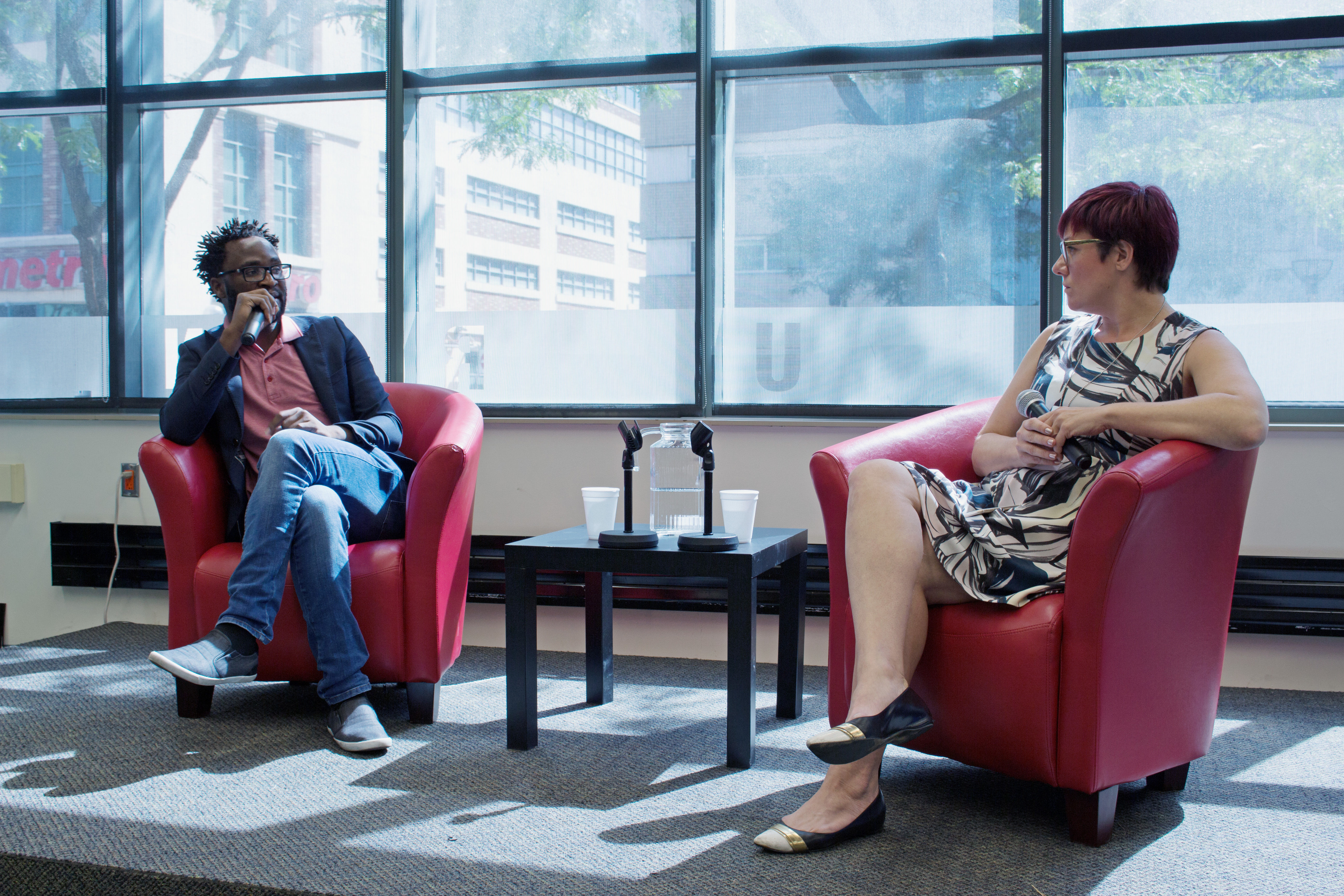 Ugandan director Kamoga Hassan discusses his film, "Outed: The Painful Reality," with journalist and queer media instructor Andrea Houston. Photo: Jessica Ross