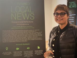 Ryerson journalism professor displays research at Ryerson event.